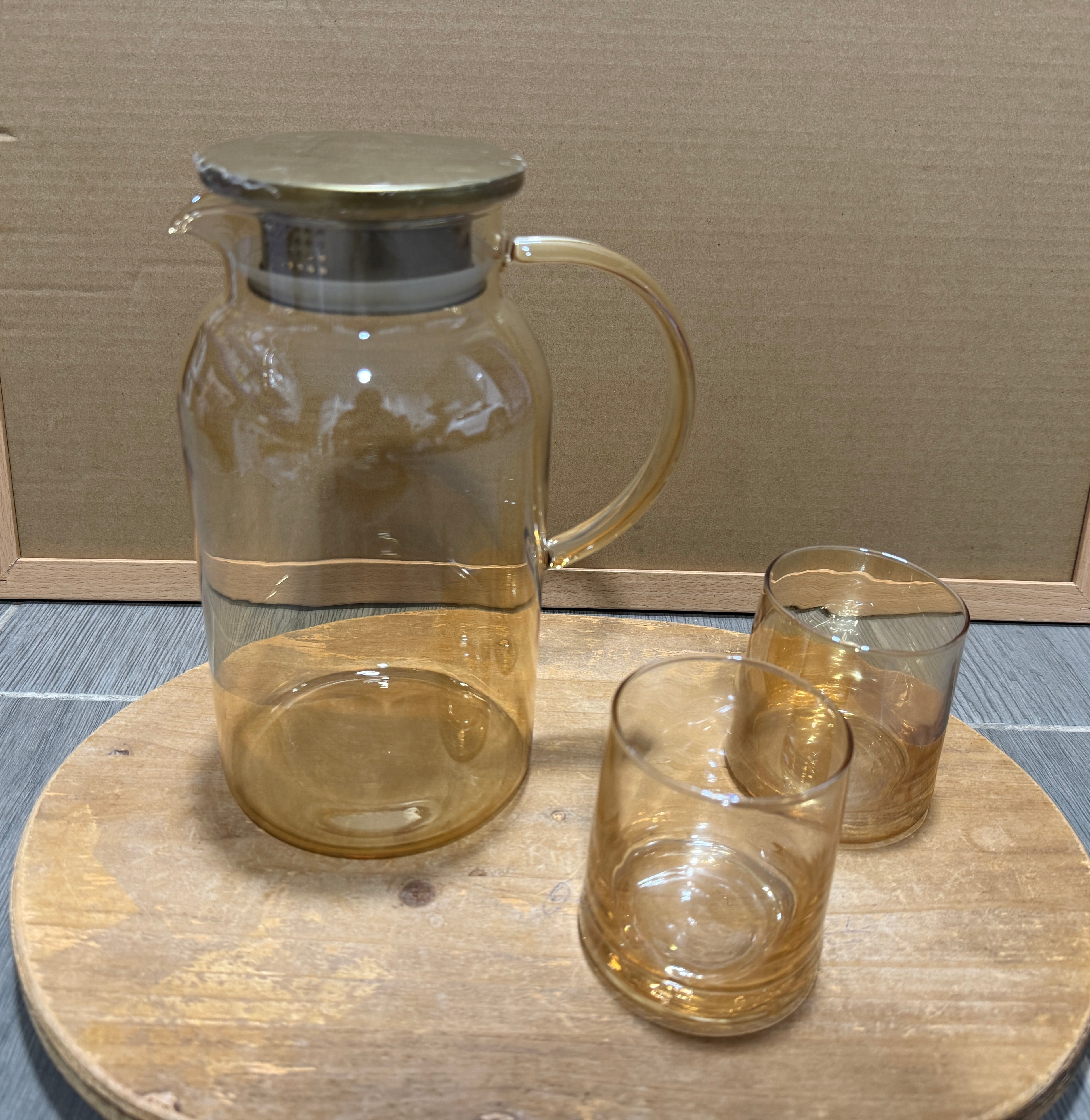 Round heat resistant glass pitcher with stainless lid and 6 glasses
