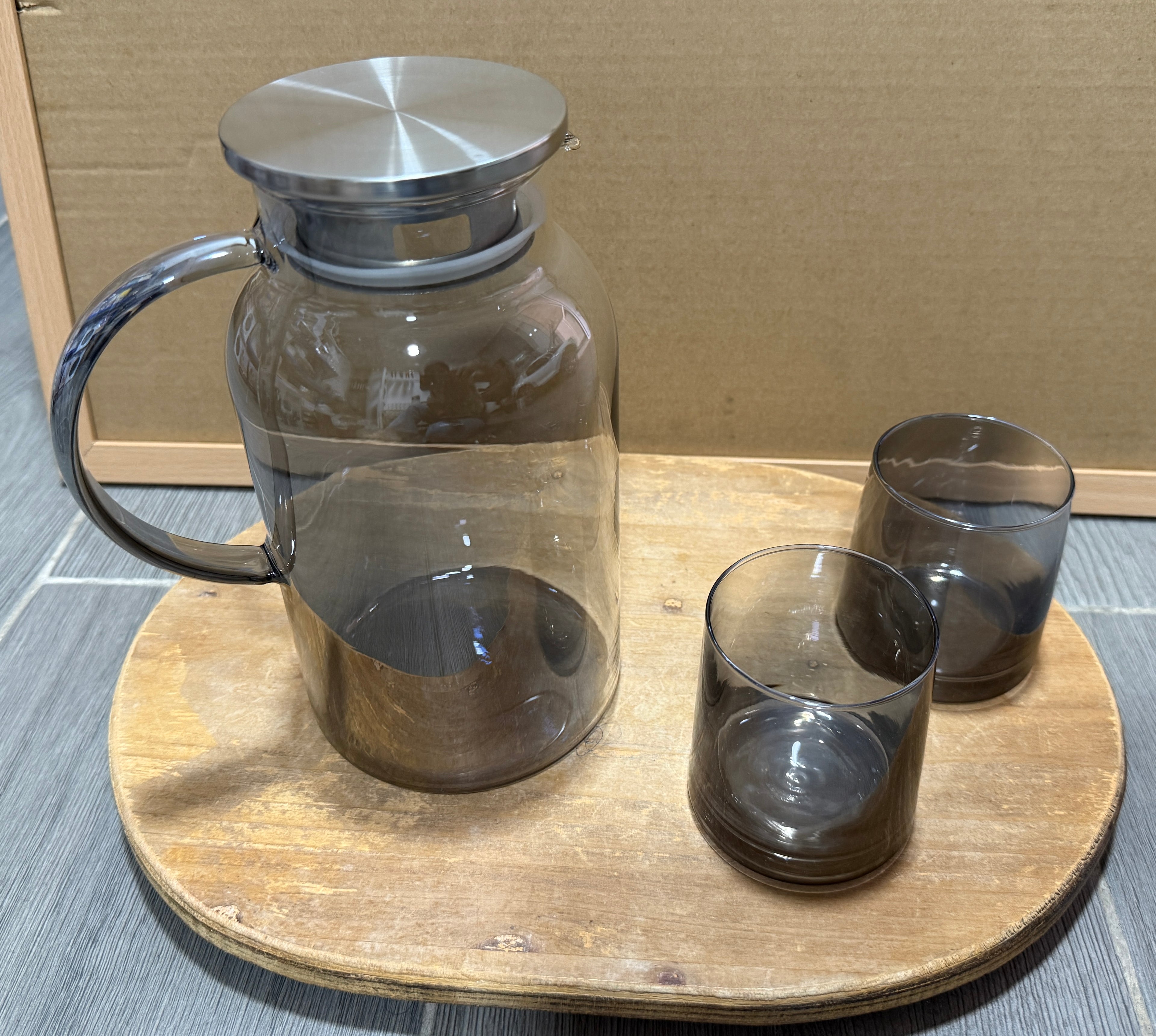 Round heat resistant glass pitcher with stainless lid and 6 glasses