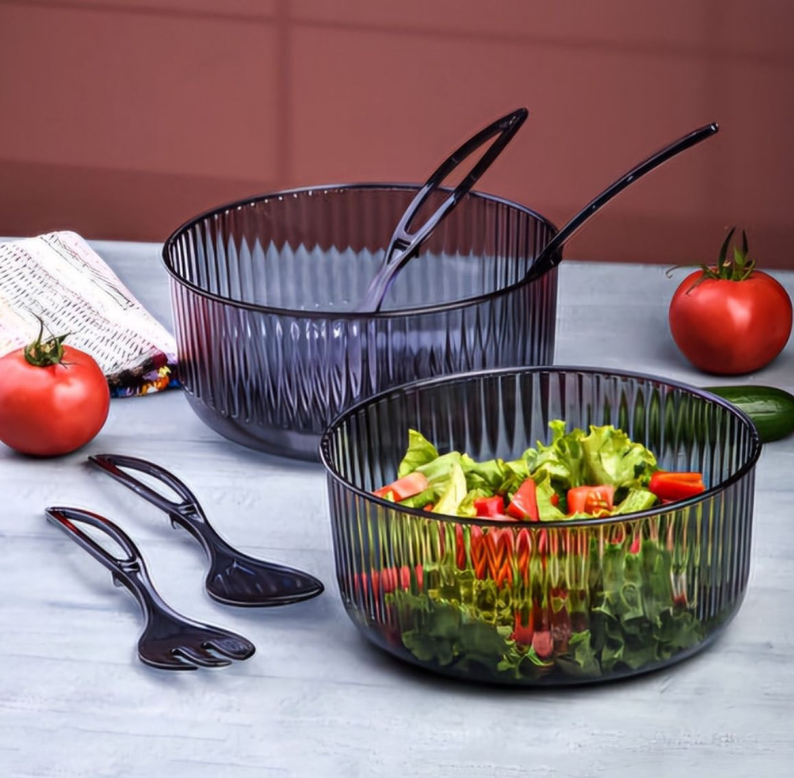 Plastic salad mixing bowl with fork and spoon